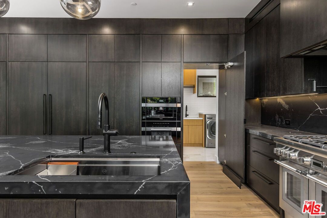 Interior, Kitchen, Recessed Lighting, Washer, Wood Texture Flooring