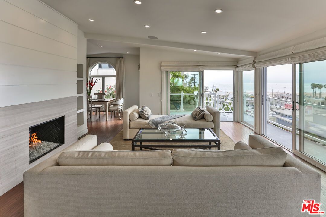 Dining room, Fireplace, Interior, Living room, Recessed Lighting, Wood Texture Flooring