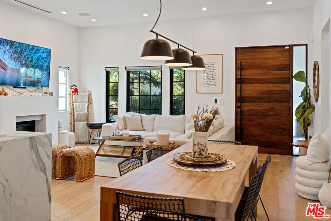 Dining room, Fireplace, Interior, Living room, Pendant Lights, Recessed Lighting, Wood Texture Flooring