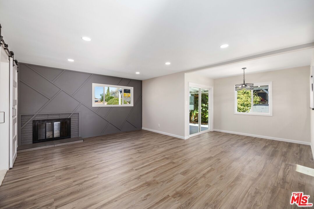Empty room, Fireplace, Interior, Pendant Lights, Recessed Lighting, Wood Texture Flooring