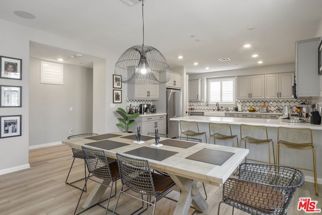 Dining room, Interior, Kitchen, Pendant Lights, Recessed Lighting, Stainless Steel Appliances, Wood Texture Flooring