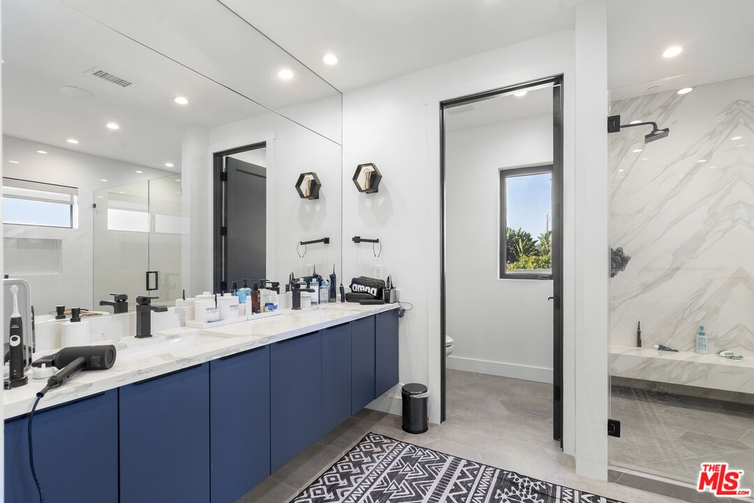 Bathroom, Dual Sink Vanities, Glass Shower, Interior, Marble Walls, Recessed Lighting