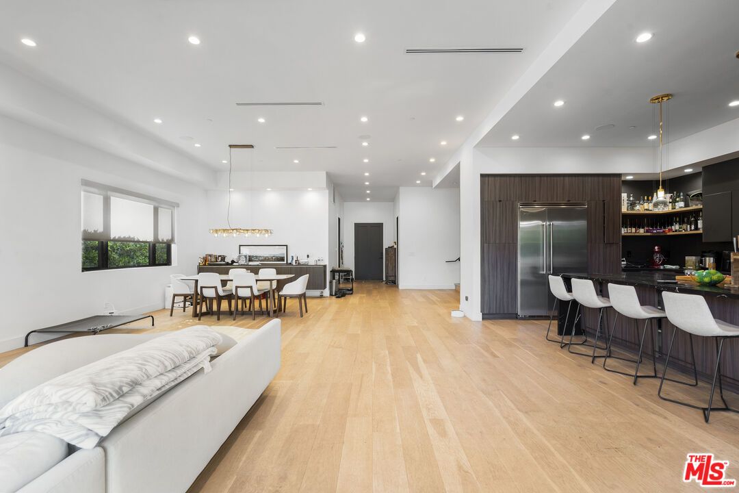 Dining room, Interior, Kitchen, Living room, Pendant Lights, Recessed Lighting, Stainless Steel Appliances, Wood Texture Flooring