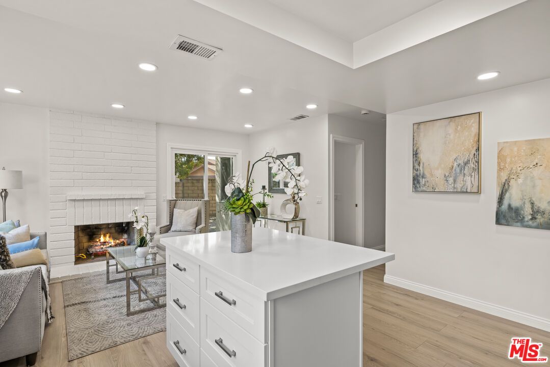 Fireplace, Interior, Living room, Recessed Lighting, Stone Walls, Wood Texture Flooring