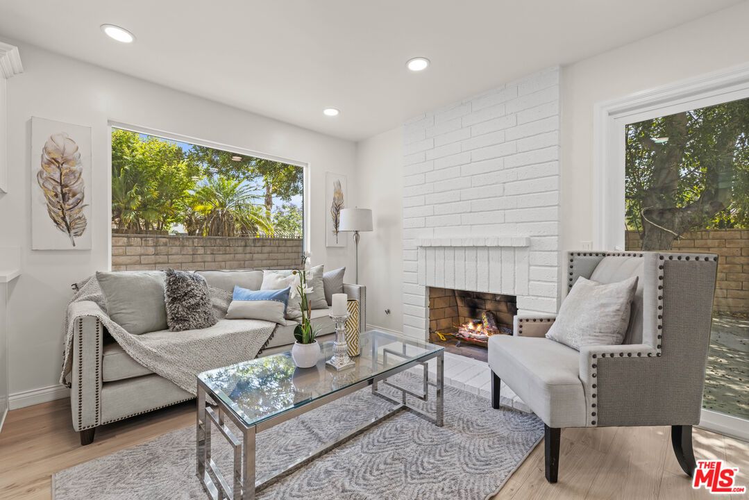 Fireplace, Interior, Living room, Recessed Lighting, Stone Walls, Wood Texture Flooring