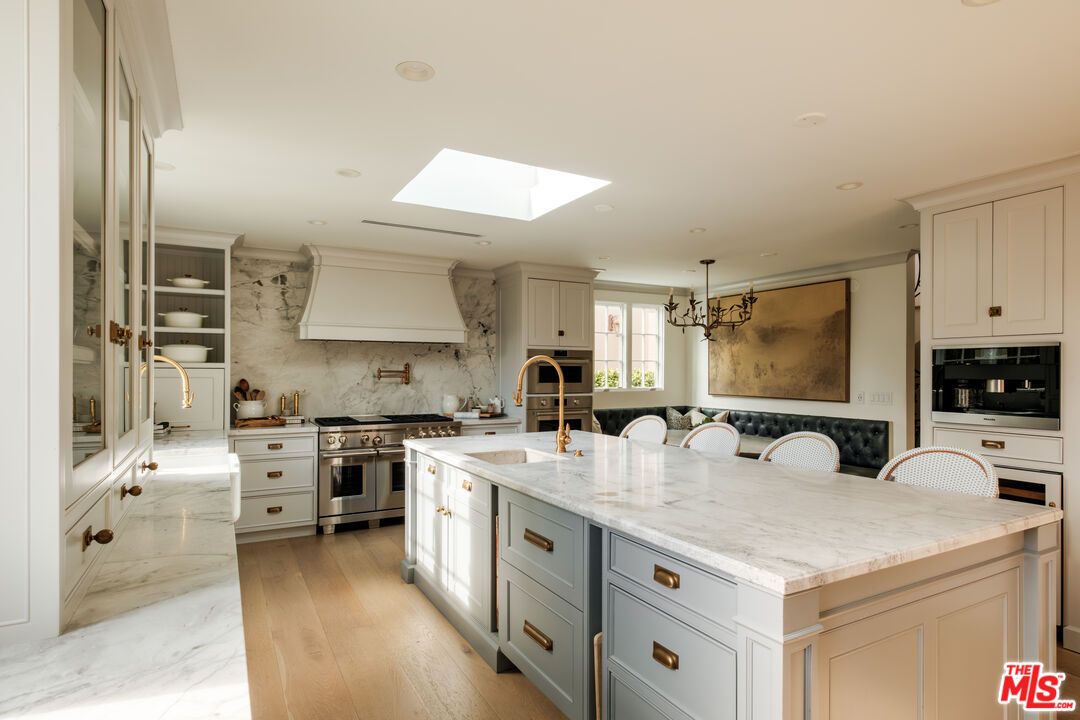 Interior, Kitchen, Marble Walls, Pendant Lights, Recessed Lighting, Stainless Steel Appliances, Wood Texture Flooring