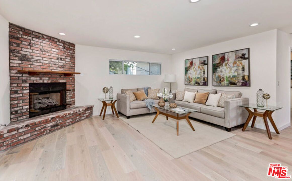 Fireplace, Interior, Living room, Recessed Lighting, Stone Walls, Wood Texture Flooring