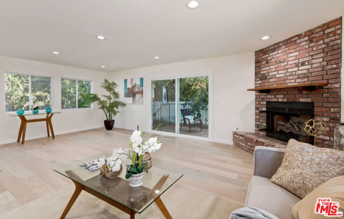 Fireplace, Interior, Living room, Recessed Lighting, Stone Walls, Wood Texture Flooring