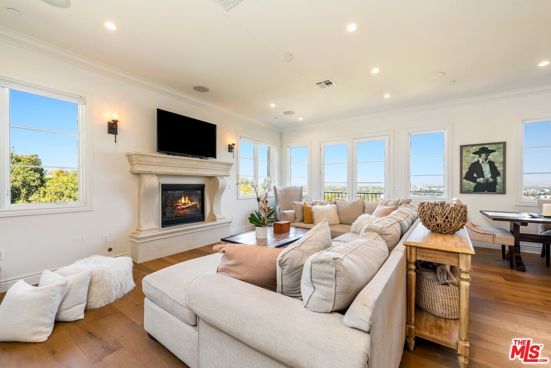 Dining room, Fireplace, Interior, Living room, Recessed Lighting, Wood Texture Flooring