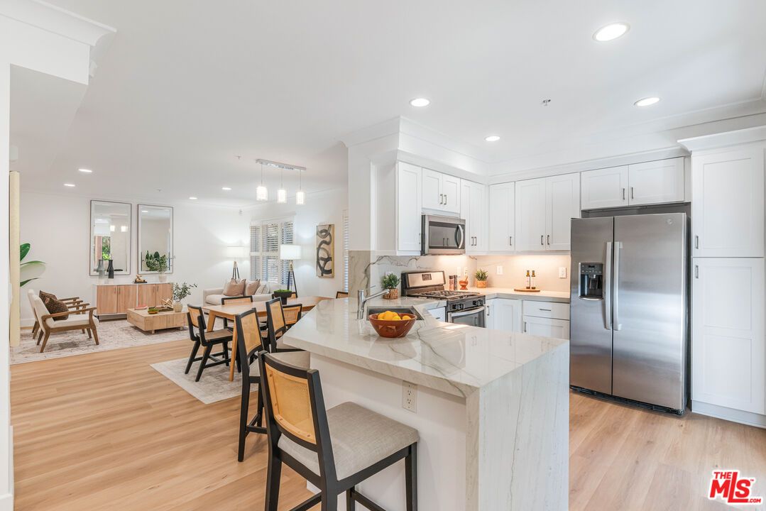 Dining room, Interior, Kitchen, Living room, Pendant Lights, Recessed Lighting, Stainless Steel Appliances, Wood Texture Flooring