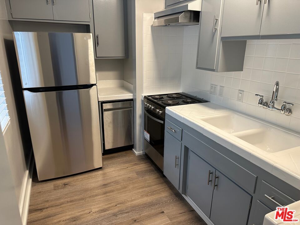 Interior, Kitchen, Tile Countertops, Wood Texture Flooring