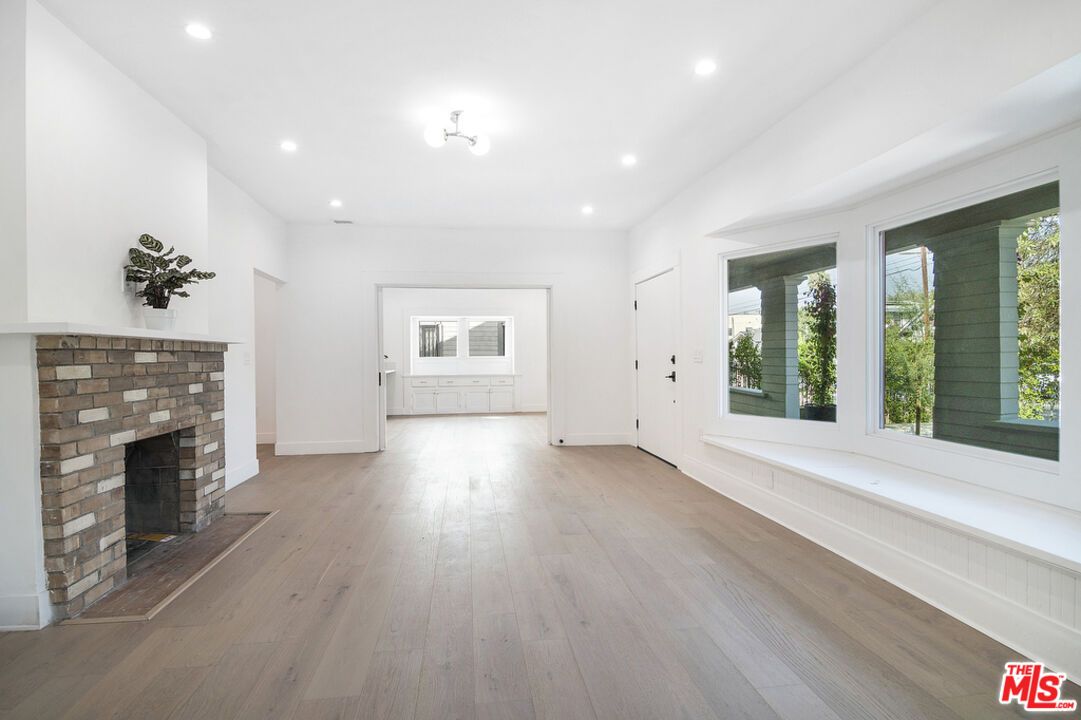 Empty room, Fireplace, Interior, Recessed Lighting, Wood Texture Flooring