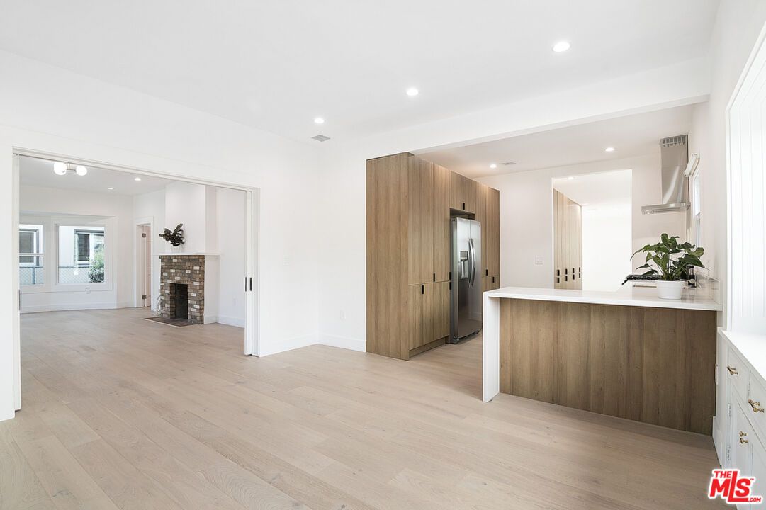 Empty room, Fireplace, Interior, Kitchen, Recessed Lighting, Wood Texture Flooring