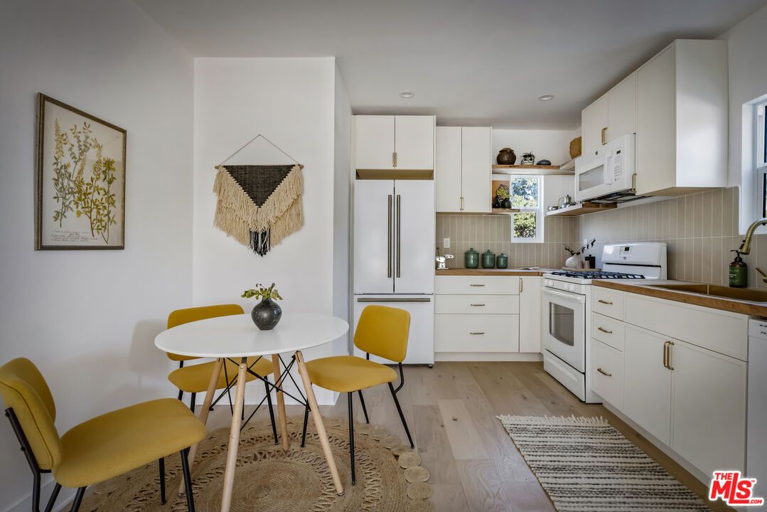 Dining room, Interior, Kitchen, Recessed Lighting, Stainless Steel Appliances, Wood Texture Flooring