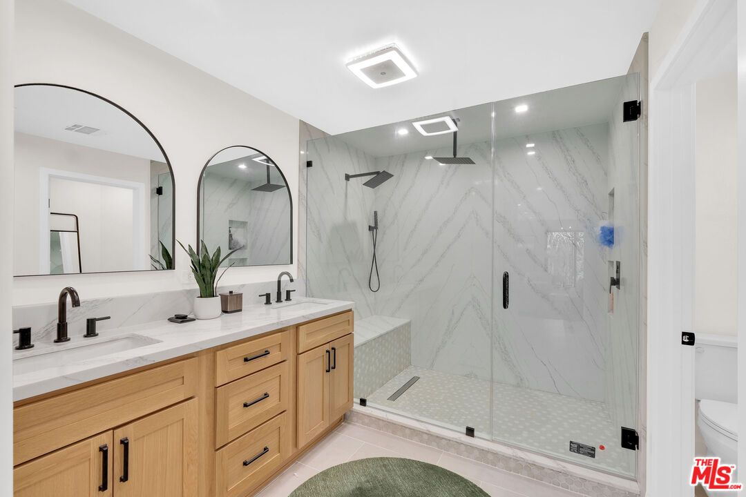 Bathroom, Dual Sink Vanities, Glass Shower, Interior, Marble Walls, Recessed Lighting