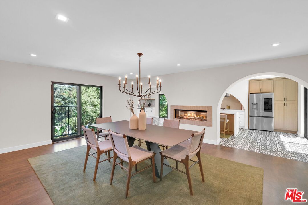 Dining room, Fireplace, Interior, Kitchen, Pendant Lights, Recessed Lighting, Stainless Steel Appliances, Wood Texture Flooring