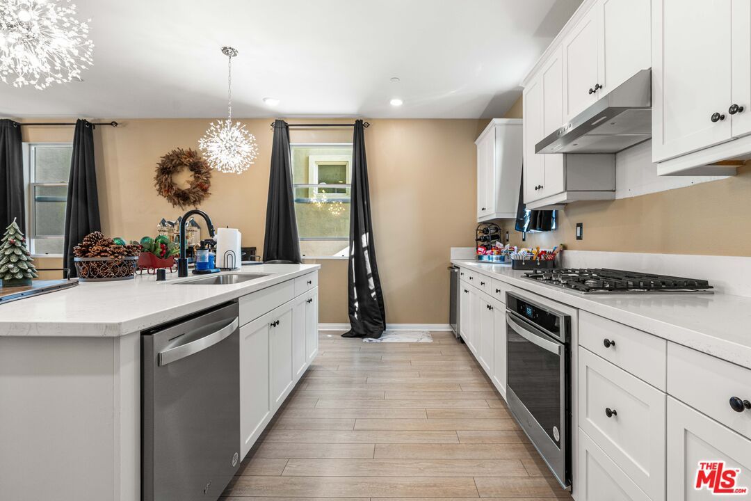 Chandelier, Interior, Kitchen, Pendant Lights, Recessed Lighting, Stainless Steel Appliances, Wood Texture Flooring