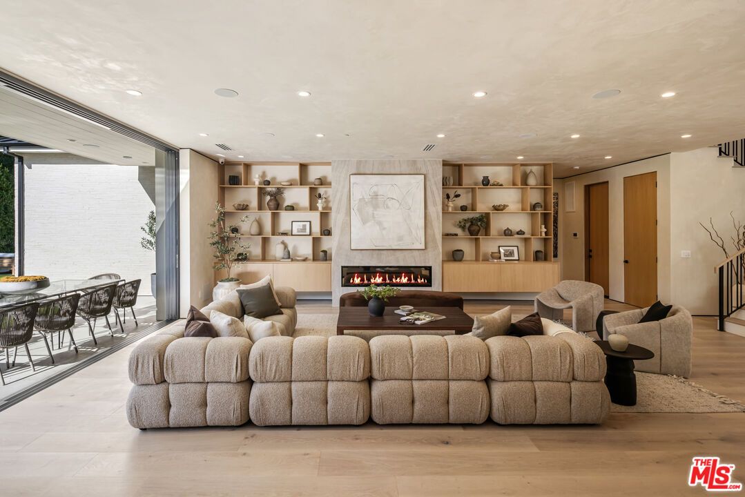 Dining room, Fireplace, Interior, Living room, Recessed Lighting, Wood Texture Flooring