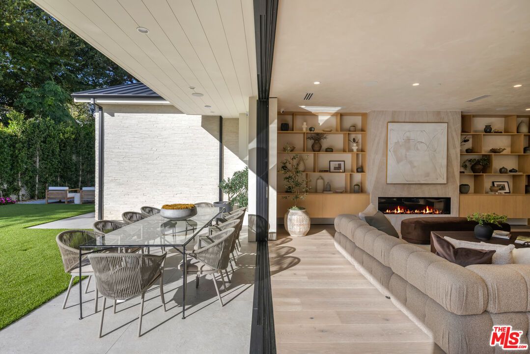 Dining room, Fireplace, Interior, Living room, Recessed Lighting, Wood Texture Flooring