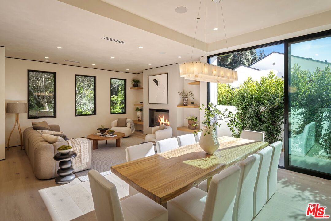 Chandelier, Dining room, Fireplace, Interior, Living room, Pendant Lights, Recessed Lighting, Wood Texture Flooring