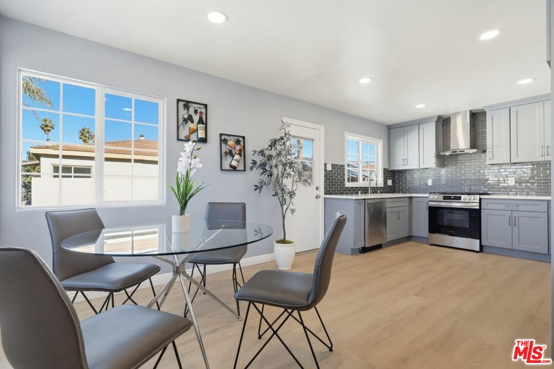 Dining room, Interior, Kitchen, Recessed Lighting, Stainless Steel Appliances, Wood Texture Flooring