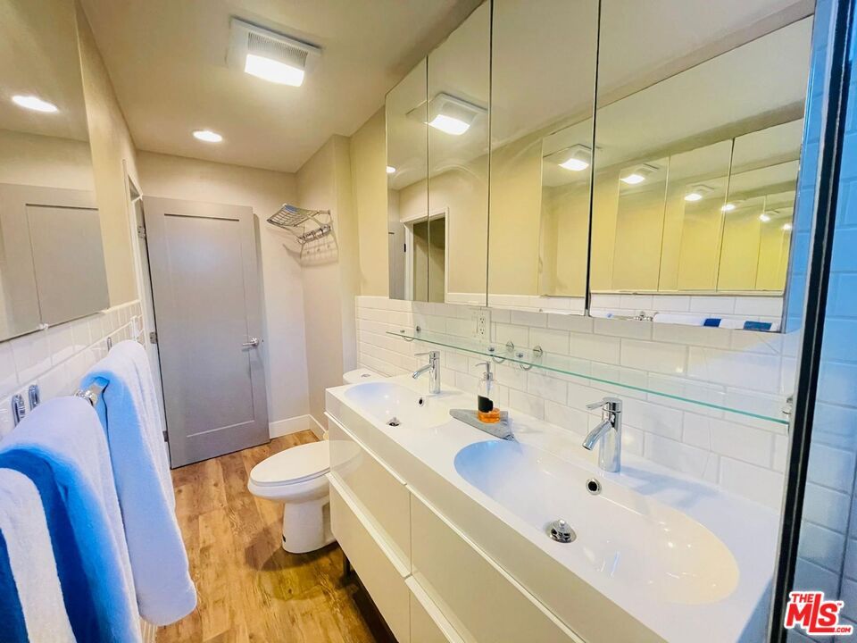 Bathroom, Dual Sink Vanities, Interior, Recessed Lighting, Wood Texture Flooring