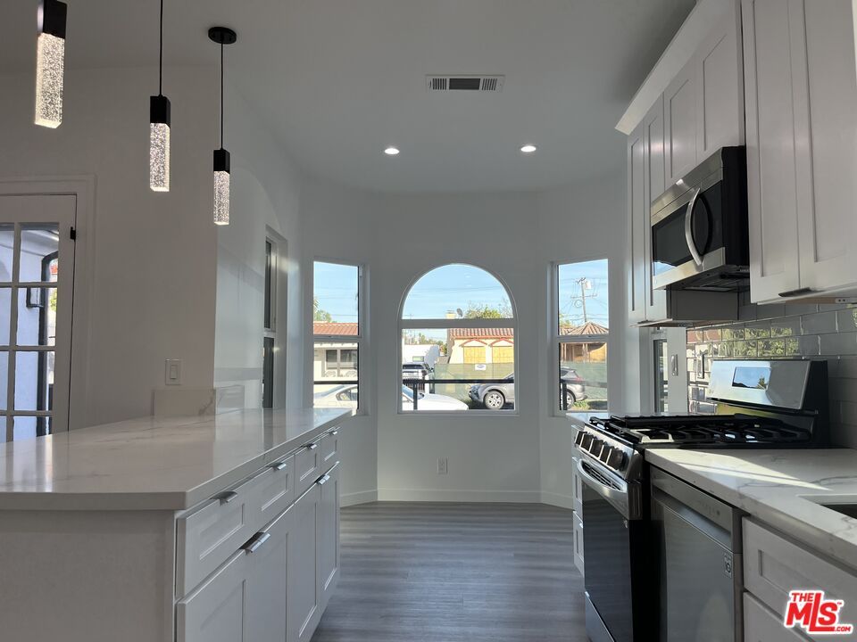 Interior, Kitchen, Pendant Lights, Recessed Lighting, Stainless Steel Appliances, Wood Texture Flooring