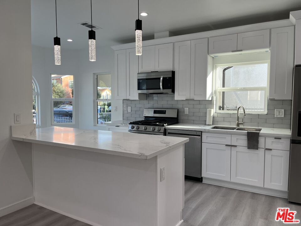 Interior, Kitchen, Pendant Lights, Recessed Lighting, Stainless Steel Appliances, Wood Texture Flooring