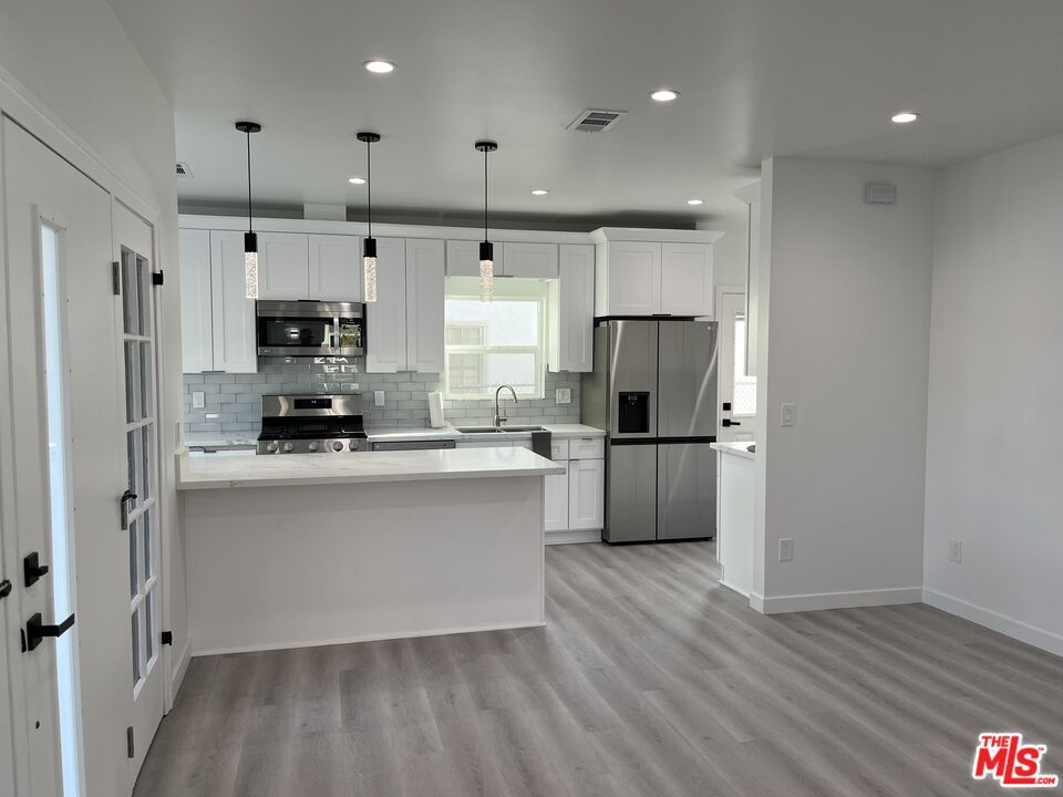 Interior, Kitchen, Pendant Lights, Recessed Lighting, Stainless Steel Appliances, Wood Texture Flooring