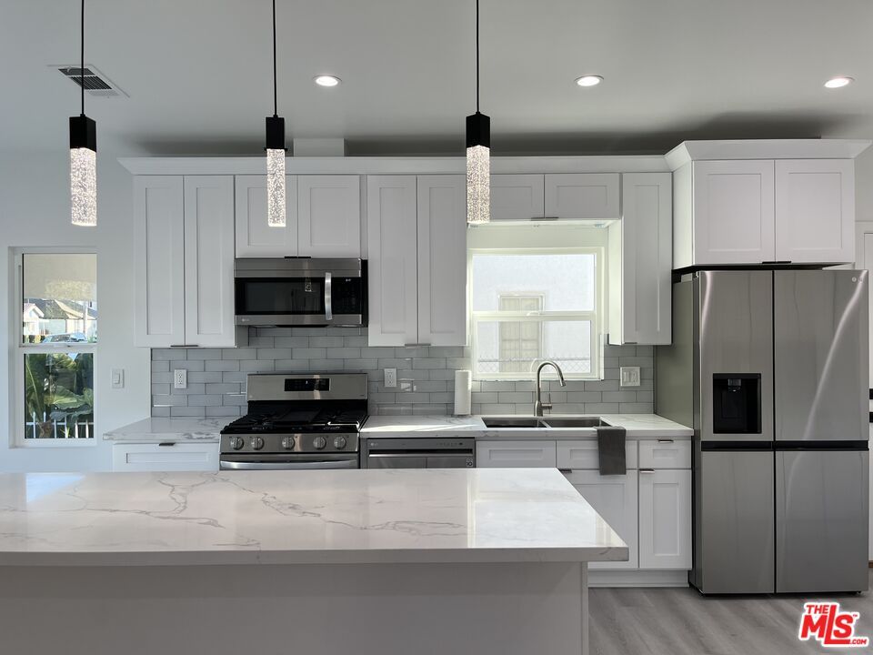 Interior, Kitchen, Pendant Lights, Recessed Lighting, Stainless Steel Appliances, Wood Texture Flooring