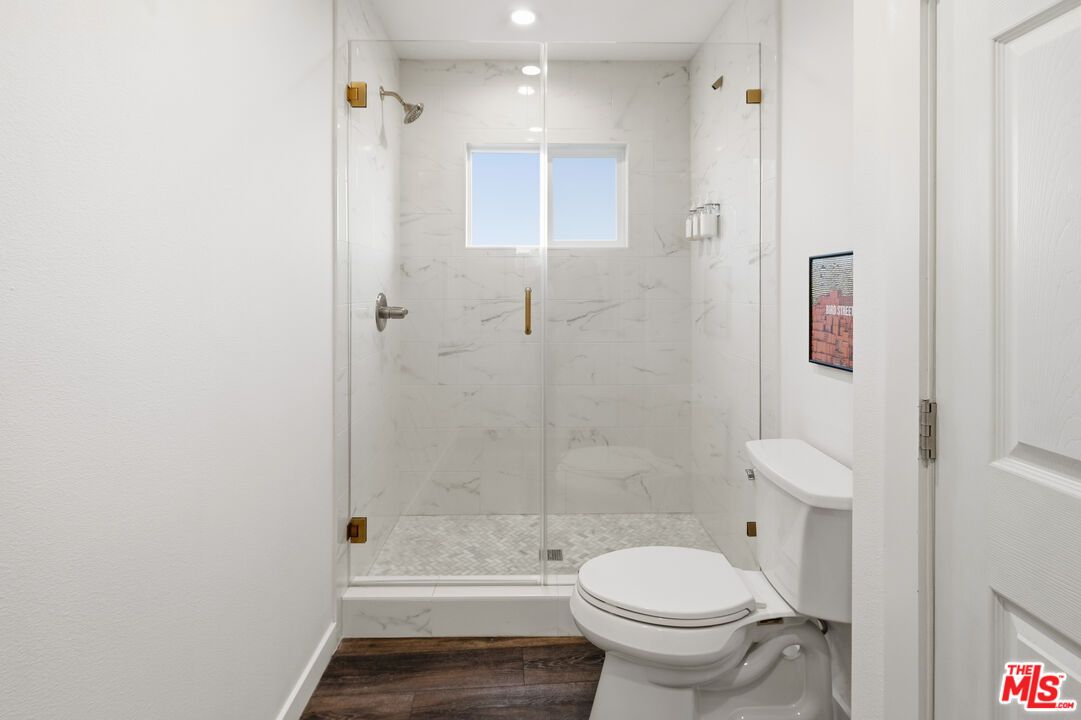 Bathroom, Glass Shower, Interior, Marble Walls, Recessed Lighting, Wood Texture Flooring