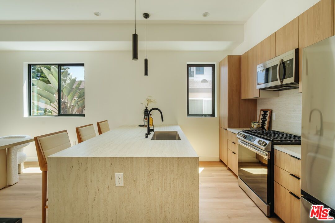 Dining room, Interior, Kitchen, Pendant Lights, Recessed Lighting, Stainless Steel Appliances, Wood Texture Flooring