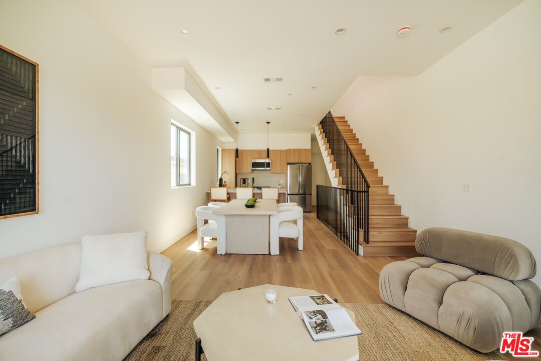 Dining room, Interior, Kitchen, Living room, Recessed Lighting, Stainless Steel Appliances, Wood Texture Flooring