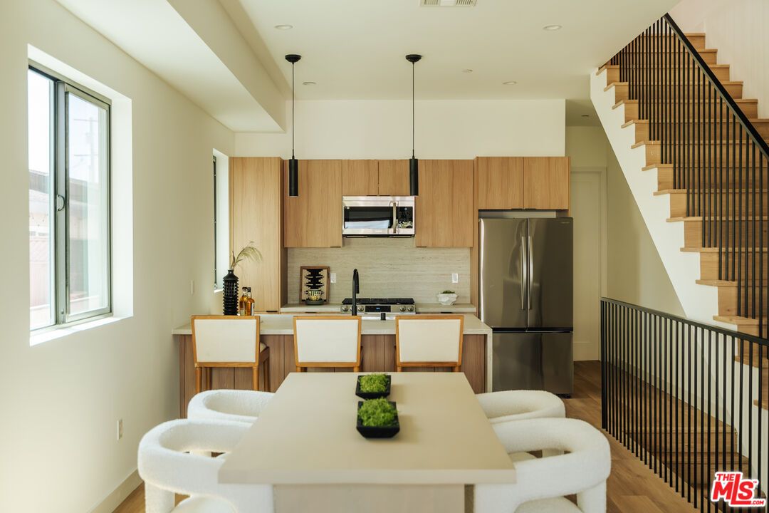 Dining room, Interior, Kitchen, Pendant Lights, Recessed Lighting, Stainless Steel Appliances, Wood Texture Flooring