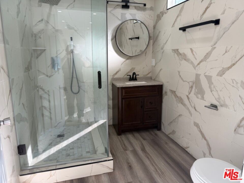 Bathroom, Glass Shower, Interior, Marble Walls, Wood Texture Flooring