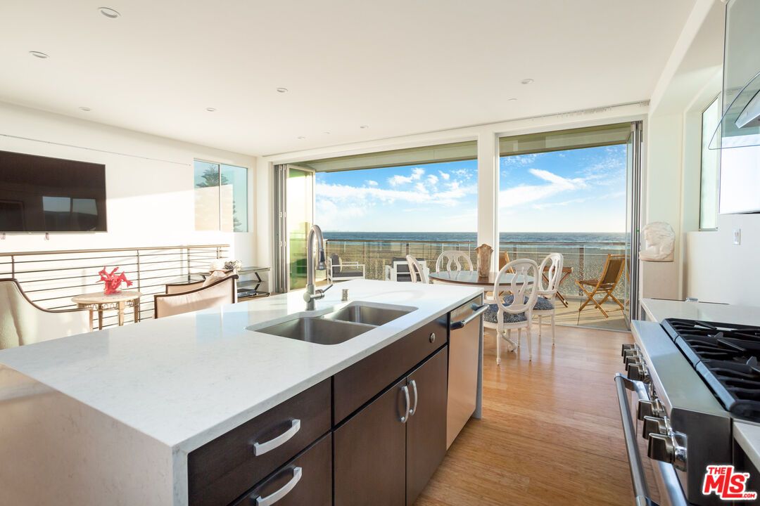 Dining room, Interior, Kitchen, Recessed Lighting, Stainless Steel Appliances, Water, Wood Texture Flooring