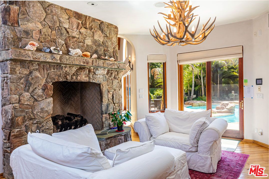 Chandelier, Fireplace, Interior, Living room, Stone Walls, Wood Texture Flooring