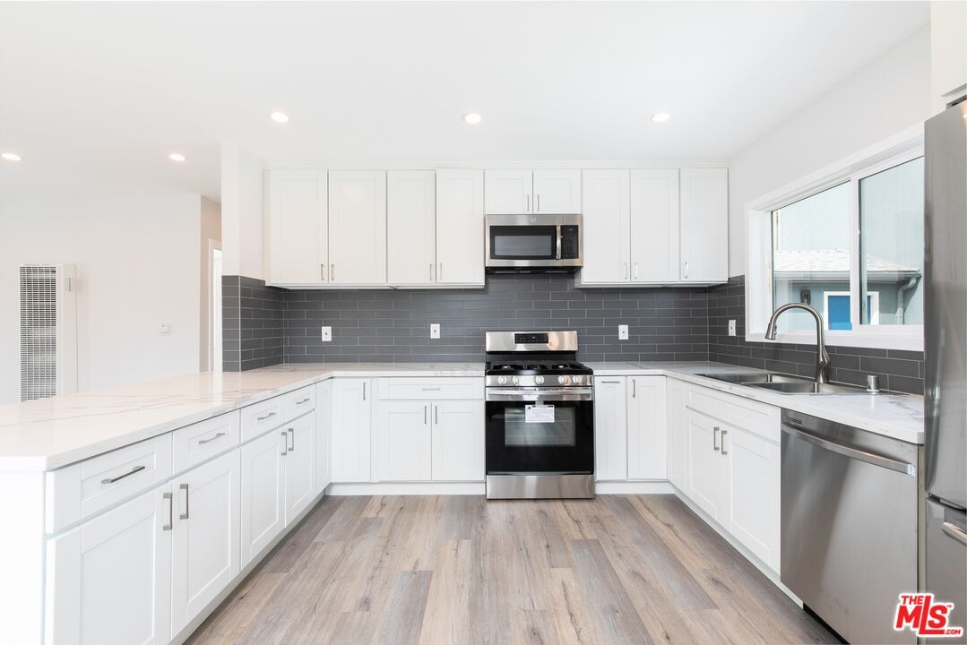 Interior, Kitchen, Recessed Lighting, Stainless Steel Appliances, Wood Texture Flooring