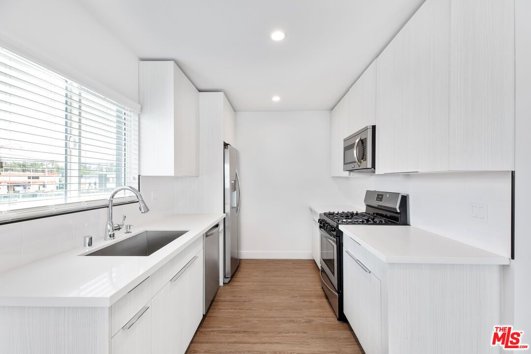 Interior, Kitchen, Recessed Lighting, Stainless Steel Appliances, Wood Texture Flooring