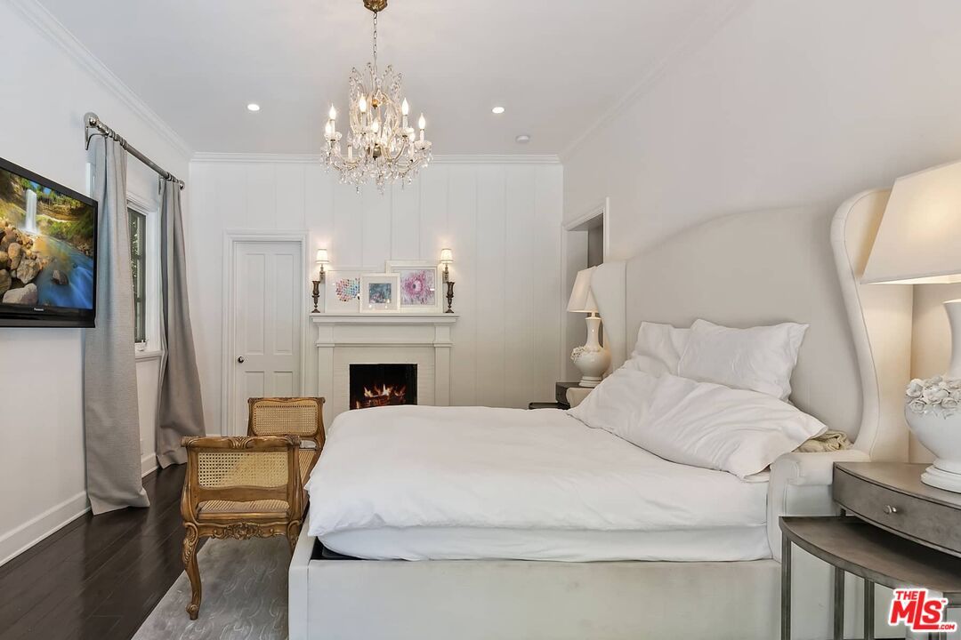 Bedroom, Chandelier, Fireplace, Interior, Recessed Lighting, Wood Texture Flooring