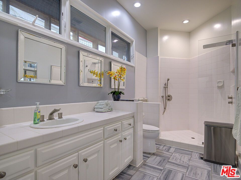 Bathroom, Dual Sink Vanities, Glass Shower, Interior, Recessed Lighting, Tile Countertops