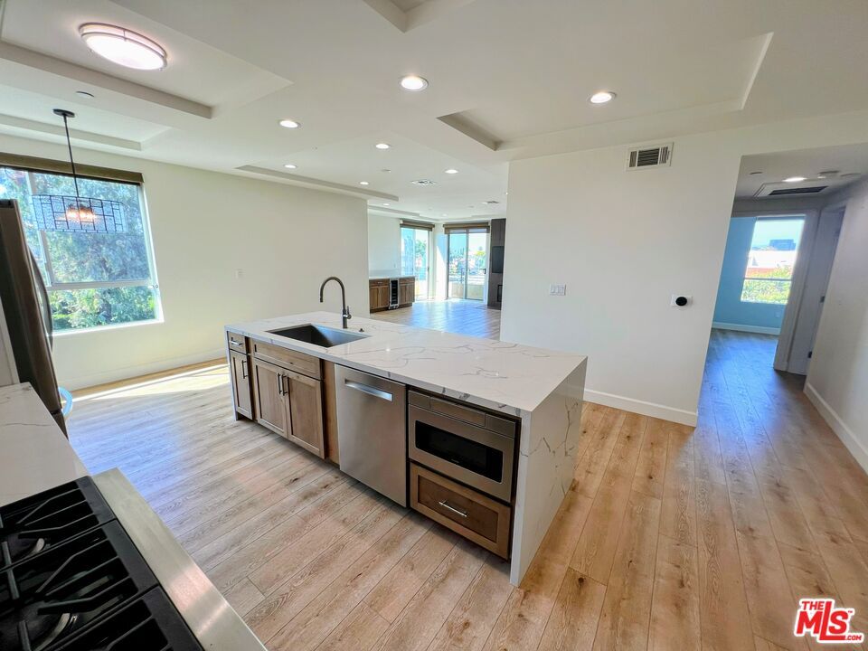 Interior, Kitchen, Pendant Lights, Recessed Lighting, Stainless Steel Appliances, Wood Texture Flooring