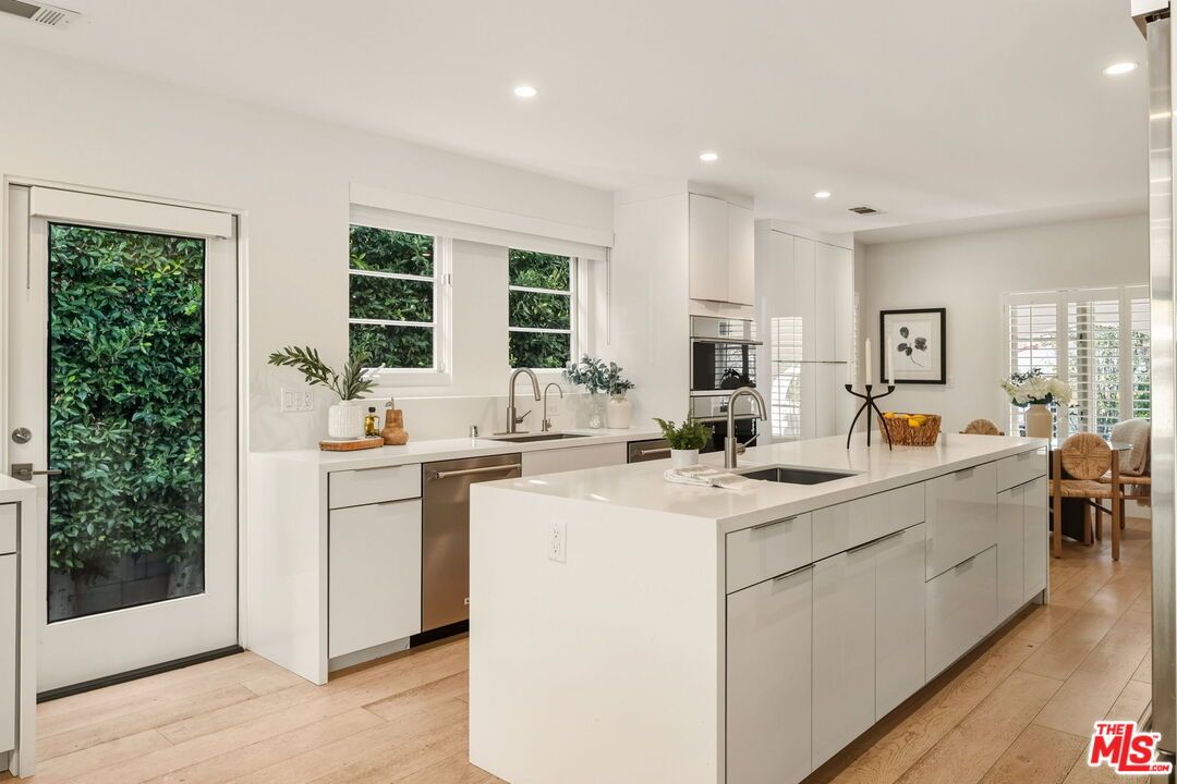 Dining room, Interior, Kitchen, Recessed Lighting, Stainless Steel Appliances, Wood Texture Flooring