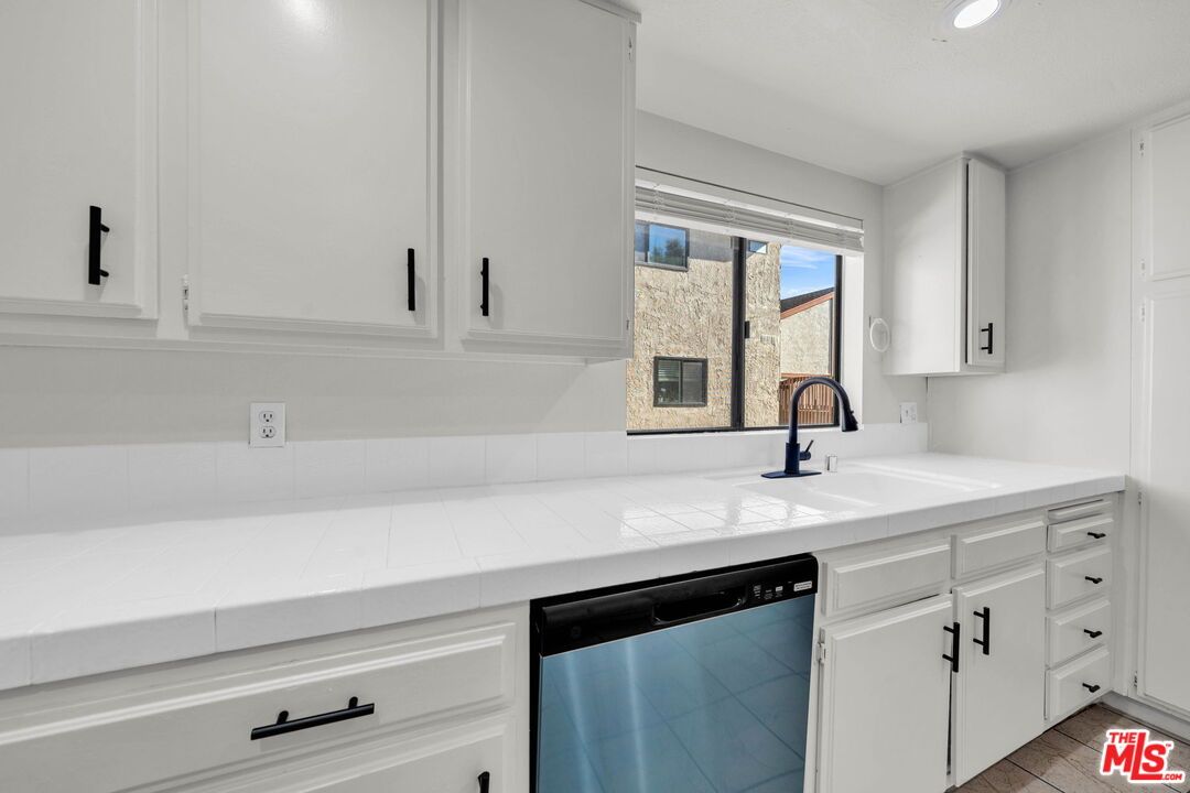 Interior, Kitchen, Recessed Lighting, Stainless Steel Appliances, Tile Countertops