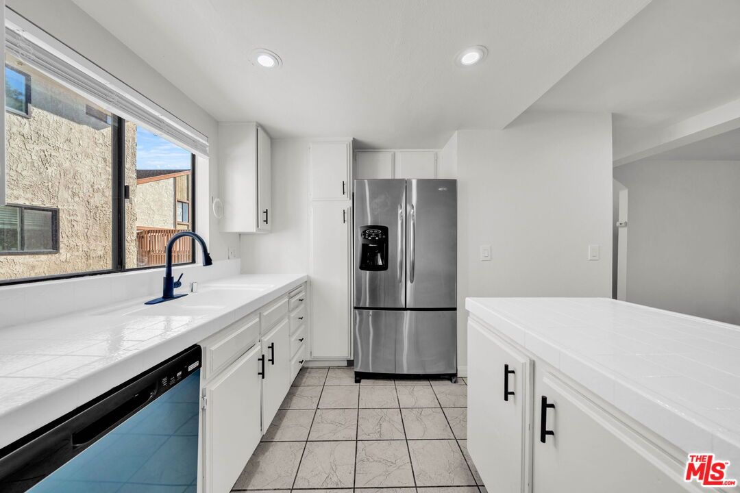 Interior, Kitchen, Recessed Lighting, Stainless Steel Appliances, Tile Countertops