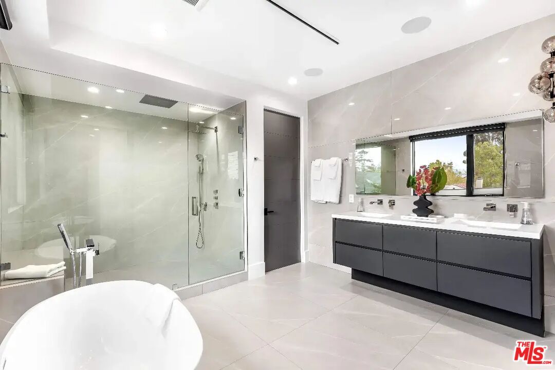 Bathroom, Dual Sink Vanities, Free Standing Baths, Glass Shower, Interior, Marble Walls, Recessed Lighting