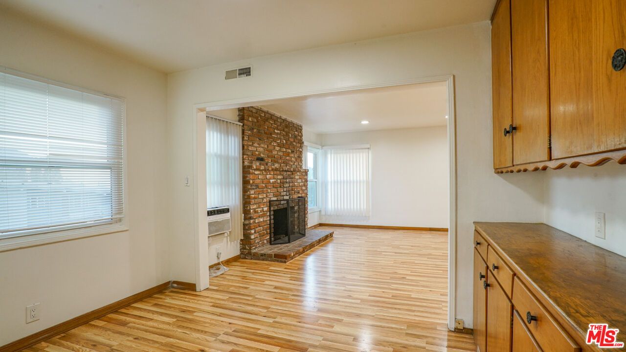 Empty room, Fireplace, Interior, Recessed Lighting, Stone Walls, Wood Texture Flooring