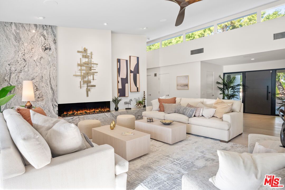 Fireplace, Interior, Living room, Marble Walls, Recessed Lighting, Wood Texture Flooring