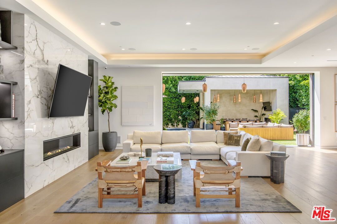 Dining room, Fireplace, Interior, Living room, Marble Walls, Pendant Lights, Recessed Lighting, Wood Texture Flooring