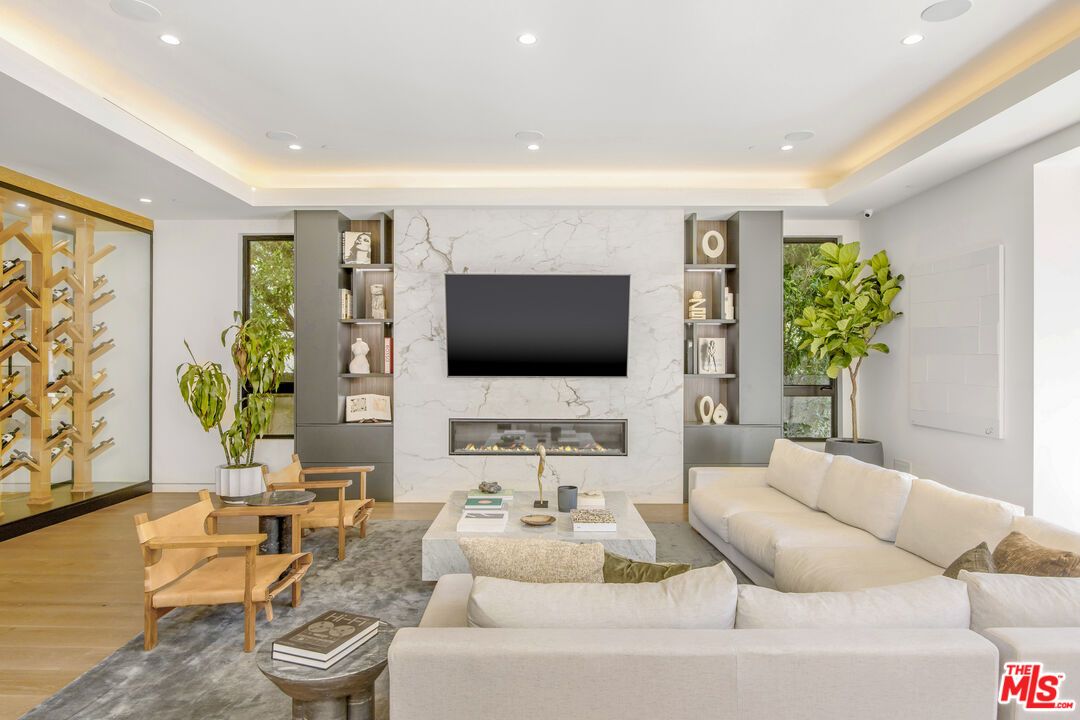 Fireplace, Interior, Living room, Marble Walls, Recessed Lighting, Wood Texture Flooring